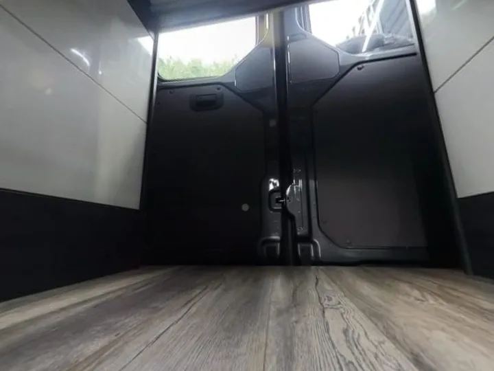 The garage under the bed of a 2017 on VW Crafter MWB, between the bed boxes, to the back doors