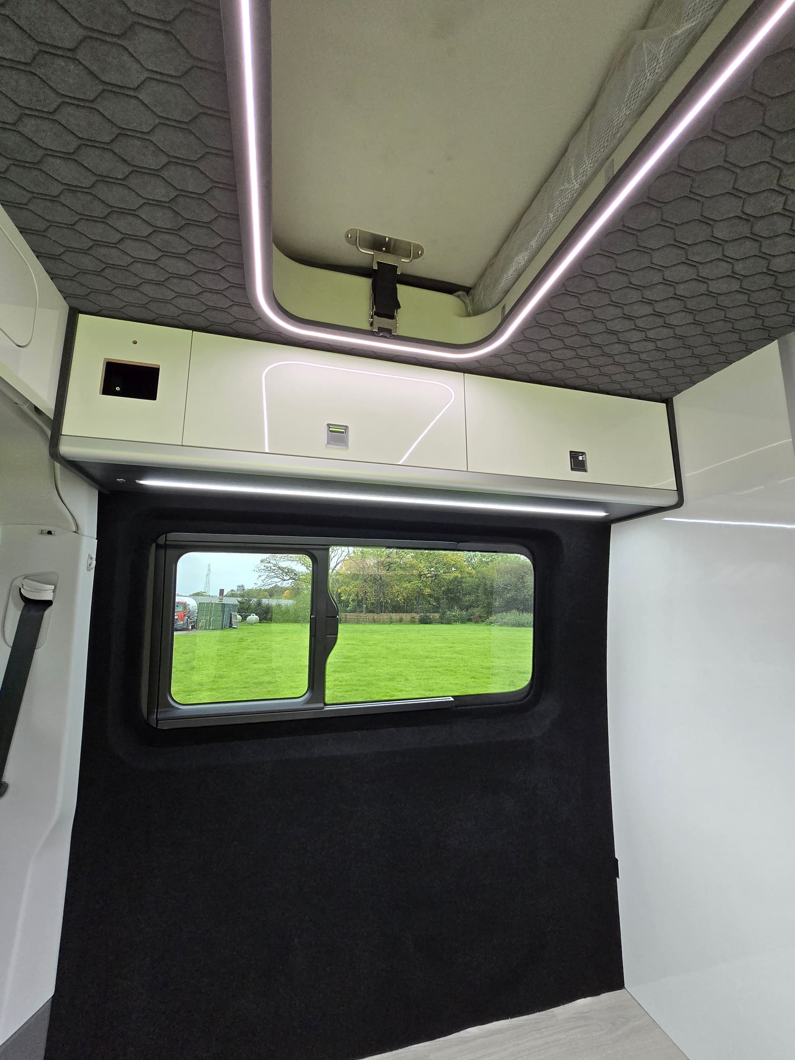 White gloss top lockers with LED lighting over a side window