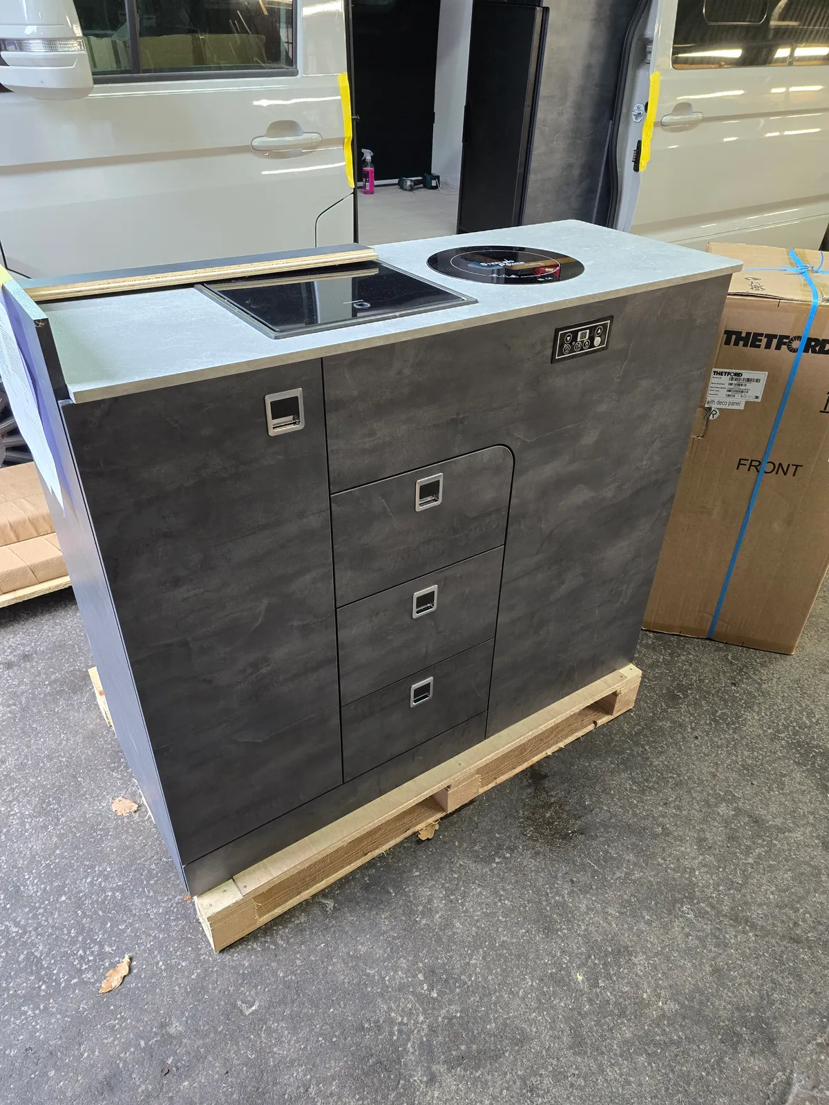 A D1 90L kitchen pod with a concrete worktop, built and assembled at our workshop
